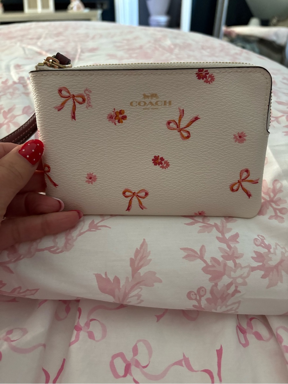 COACH Cream Wristlet with Pink & Orange Bow Print